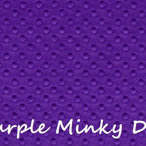 May include: A vibrant purple fabric featuring a raised, embossed dot pattern across the entire surface. The material has a soft, textured appearance with consistent circular indentations. The text Purple Minky Dot is printed in white.