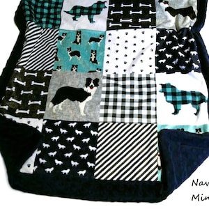 May include: A patchwork blanket featuring a navy blue minky dot border and various square fabric panels. The patterns include black and white dog silhouettes, teal and black buffalo plaid dogs, white bones, black and white stripes, and paw prints.