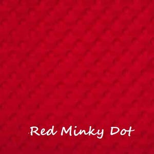 May include: Red minky dot fabric with a subtle textured pattern. The fabric is a solid red colour with a small white dot pattern.