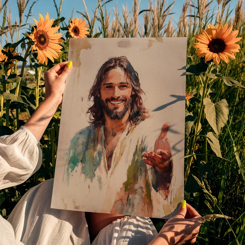 May include: A watercolor print of a smiling man with long brown hair and a beard, wearing a white robe. The print is held in front of a background of sunflowers and tall grass.