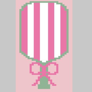 May include: A pink and white striped lollipop with a green border and a pink bow.