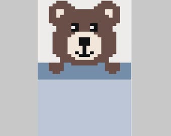 Patrón de manta de punto grueso para tejer a mano con un oso sonriente en la cama