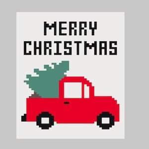 May include: A pixelated Christmas card design featuring a red truck carrying a green Christmas tree. The words "MERRY CHRISTMAS" are displayed in bold, pixelated black letters against a cream background.