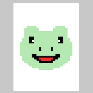 May include: A pixelated green frog with a wide, red smile and black eyes.