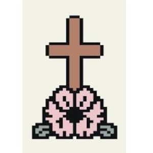 Puede incluir: Una cruz de madera marrón con una corona de flores rosas en la base. La flor tiene un centro negro y está rodeada de dos piedras grises.