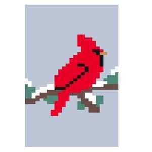 Cardinal sur une branche enneigée - tricot avec les doigts / modèle de couverture en grosses mailles