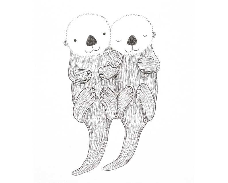 Two sea otter is linking arms/holding hands and snuggling.  One otter has eyes closed, another one's eyes are open.  Both of them are smiling.