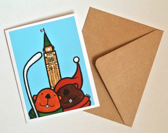 Carte J'aime le Canada, cadeau canadien, carte de soutien Canada, carte d'anniversaire canadienne, castors de hockey mignons, art populaire canadien, carte fabriquée au Canada