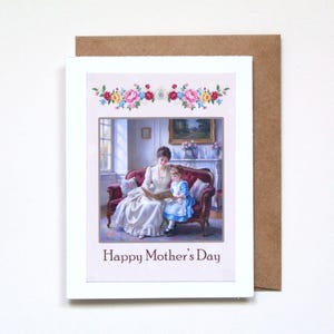May include: A Mother's Day card with a vintage illustration of a mother and child reading on a red sofa. The card has a floral border and the text "Happy Mother's Day". The card is set against a brown envelope, perfect for sending to a loved one.