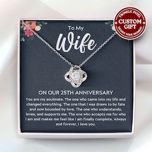 May include: A silver necklace with a crystal knot pendant comes in a black gift box with a message that reads "To My Wife On Our 25th Anniversary". The message continues with a heartfelt message about love and commitment.