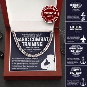 May include: A silver chain necklace presented in a wooden gift box. The box contains a navy blue card with the text "Congratulations on Completing Your Basic Combat Training" and the name "James Carter". A custom gift label is visible.