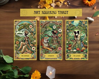 May include: Three tarot cards from the Art Nouveau Tarot deck. The Empress card features a woman in a green dress sitting on a throne surrounded by lush greenery. The Strength card shows a woman with a tiger. The Lovers card depicts a couple standing in a jungle setting.