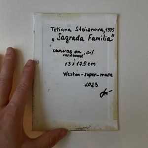 May include: A piece of art titled "Sagrada Familia" by Tetiana Stoianova, 1995. The artwork is on canvas and oil cardboard, measuring 5.1 x 6.9 inches. The location is Weston-super-mare, 2023.