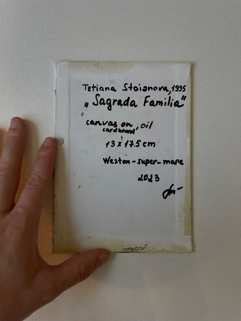 May include: A piece of art titled "Sagrada Familia" by Tetiana Stoianova, 1995. The artwork is on canvas and oil cardboard, measuring 5.1 x 6.9 inches. The location is Weston-super-mare, 2023.