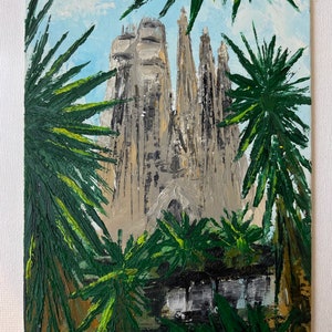 May include: An oil painting depicts a towering cathedral with intricate spires, framed by lush green palm fronds. The artwork uses a palette of beige, gray, and green, set against a light blue sky. The brushstrokes create a textured, impressionistic effect.
