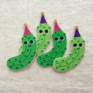 May include: Four embroidered green pickle patches with smiling faces, wearing party hats with gold glitter tops. The patches are on a light beige fabric background. The Etsy shop name is visible at the bottom.