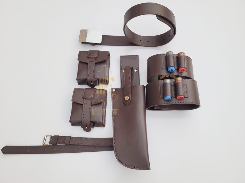 May include: Brown leather belt with a silver buckle, two small brown leather pouches, and a larger brown leather pouch with a flap. There is also a brown leather belt with two rows of loops for holding shotgun shells.