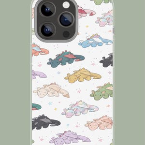 May include: A transparent phone case with a repeating pattern of cartoon dragons in various colours. Dragons are pink, blue, green, and yellow, with star accents. The case has a camera cutout.