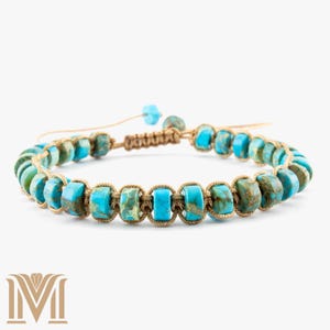 May include: A turquoise beaded bracelet with an adjustable macrame clasp. The bracelet features rectangular turquoise beads in shades of blue and green, strung on a beige cord. The macrame knot allows for size adjustment.