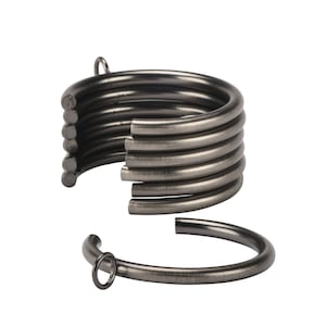 May include: A set of eight silver curtain rings. The rings are stacked on top of each other, with one ring separated from the stack.