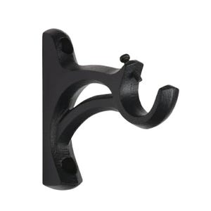 May include: A black, cast iron curtain rod bracket. The bracket has a curved design with a screw for securing the rod. The bracket is designed to be mounted on a wall and is a decorative and functional hardware item.