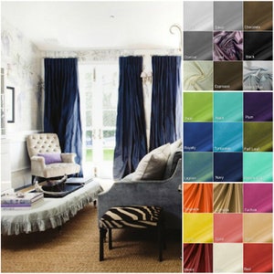 May include: A room with navy blue curtains, a tufted armchair, and a gray sofa. A small zebra-print ottoman sits in front of the sofa. Color swatches of fabric samples are displayed on the right, including colors like silver, black, and turquoise.