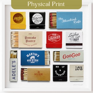 May include: A white framed print of nine matchbox labels, each with a different design and text. The labels are arranged in a grid pattern. The labels feature different colors, including yellow, red, blue, black, and brown. The labels feature text such as 