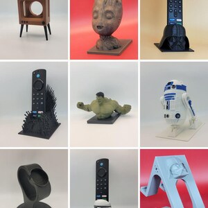 May include: Nine different 3D printed remote control holders featuring various characters from popular movies and TV shows. The holders are made of black, brown, white, and gray plastic. The characters include Groot, Darth Vader, the Iron Throne, Hulk, R2-D2, a Stormtrooper, and Darth Vader.