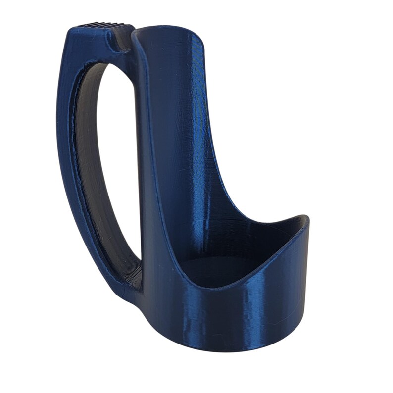 May include: A dark blue plastic cup holder with a handle. The holder is designed to hold a cup or bottle securely.