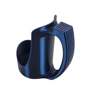May include: A dark blue plastic cup holder with a handle. The holder has a textured surface and a raised lip around the top.