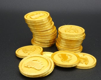 以下が含まれることがあります： 動物のデザインが施された金色のコインの積み重ね。コインはピラミッド型に積み重ねられており、一番上が一番大きく、一番下が一番小さい。コインはすべて光沢のある金属製で、表面は滑らかです。