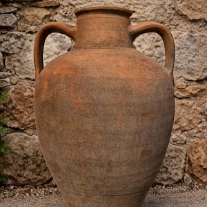 May include: A rustic wooden sign with the text "Welcome to our home" in white lettering. The sign features a distressed finish and a simple, inviting design, perfect for a front porch or entryway.