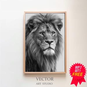 May include: Black and white framed print of a lion's face. The lion has a full mane and is looking directly at the viewer. The text "VECTOR ART STUDIO" is at the bottom of the print. A red "BUY 2 GET 1 FREE" sticker is in the bottom right corner.