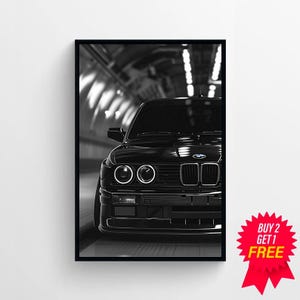 May include: Black and white photograph of a black BMW E30 in a tunnel. The car is facing the camera and the headlights are on. The car is in focus and the background is blurred.
