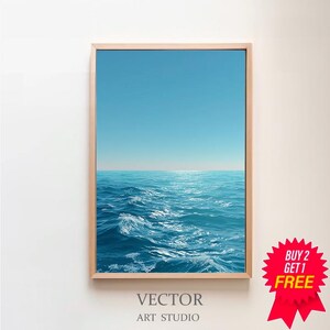 May include: A framed print of the ocean with a clear blue sky. The artwork features a realistic depiction of waves in shades of blue. The frame is a light wood color. The text "VECTOR ART STUDIO" is at the bottom.