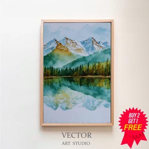 May include: Watercolor painting of a mountain landscape with a lake, framed in light wood. The artwork features snow-capped mountains, green trees, and a reflective lake. The text "VECTOR ART STUDIO" is at the bottom.
