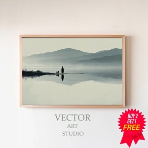 Könnte beinhalten: Gerahmter Kunstdruck mit einer ruhigen Landschaft, die eine Person und einen Hund zeigt, die an einem Gewässer entlanggehen, mit Bergen im Hintergrund. Das Kunstwerk ist in Grau- und Weißtönen gehalten, mit dem Text "VECTOR ART STUDIO" am unteren Rand.