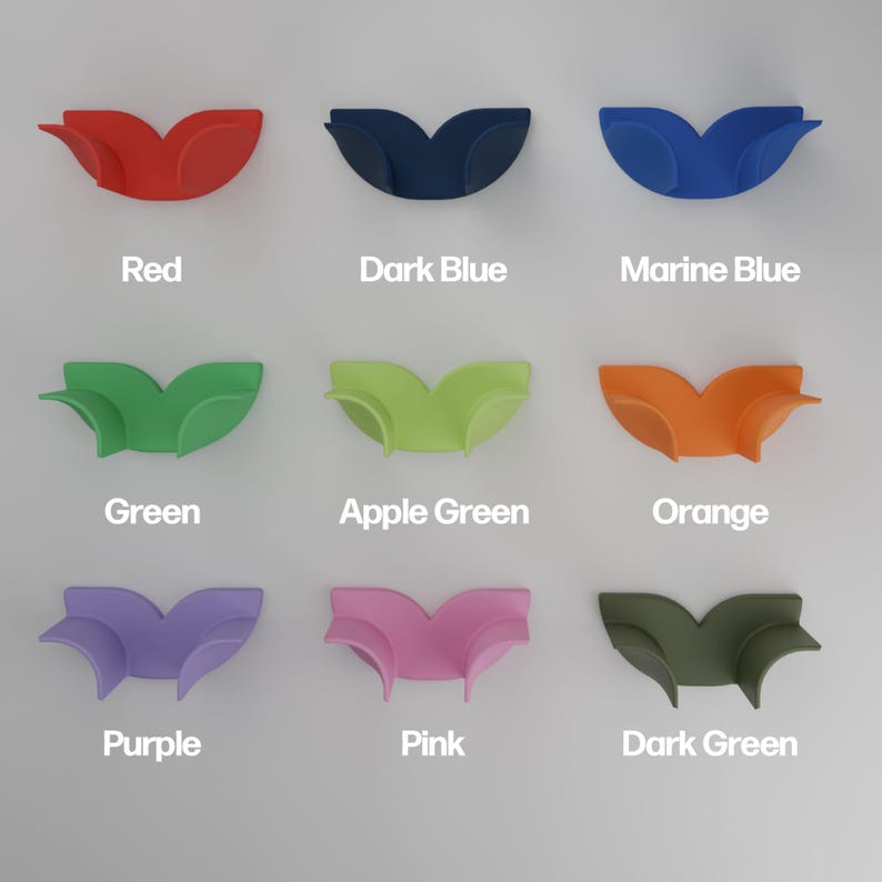May include: A grid of nine curved, wing-shaped silicone holders in various colors, each labeled with its corresponding color name: Red, Dark Blue, Marine Blue, Green, Apple Green, Orange, Purple, Pink, and Dark Green, arranged in three rows.