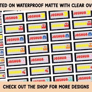 May include: A sheet of waterproof matte stickers with a clear overlay. The stickers feature a Pac-Man inspired design with the name "Joshua" printed on each sticker.