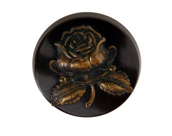 3.5cm. 1 repousse button,antique picture button,trailing rose design with black and white color backing