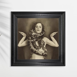 May include: A white ceramic mug with a black handle and the text "But First, Coffee" in a black, bold font. The mug is on a white surface.