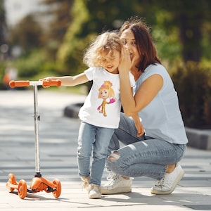 The fixes cartoons, Simka on a picture in orange and pink color. Simka,Toddler Tee.(for USA)