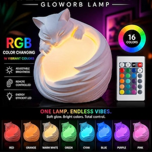 May include: A white cat-shaped LED lamp with the text "SLEEPING CAT - GLOWORB LAMP". The lamp has adjustable brightness and 16 vibrant colour options, controlled by a remote. The lamp is energy efficient.