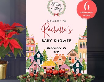 Könnte beinhalten: Ein Willkommensschild für eine Babyparty mit dem Text "Willkommen zu Rachelles Babyparty am 18. Dezember 2024". Das Schild hat einen rosa Hintergrund mit einer Dorfillustration und ist mit Weihnachtsschmuck und einer Poinsettie dekoriert.