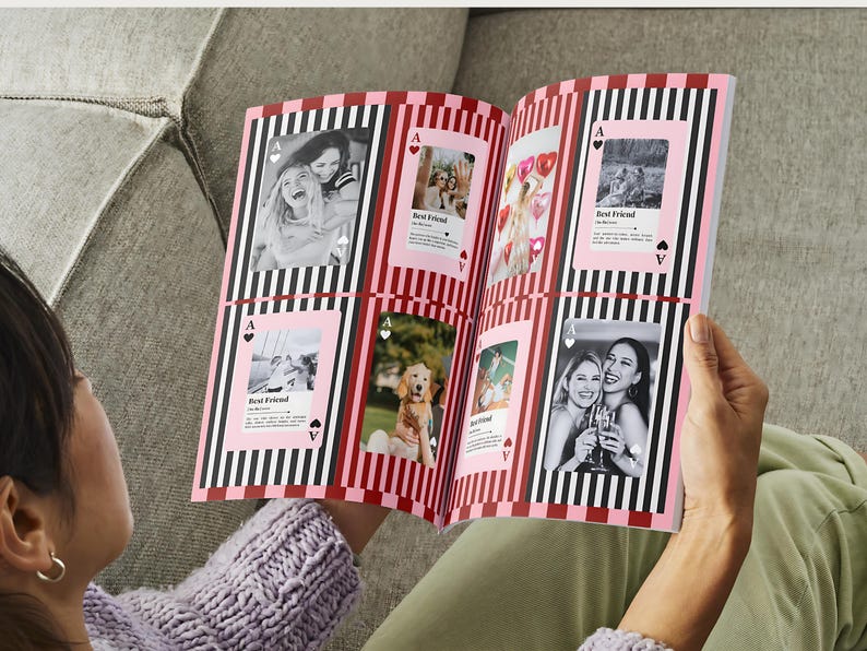 May include: Open photo album with black and white striped borders and pink card-shaped photo frames. Photos include images of friends and a dog. The text "Best Friend" is visible on some frames.