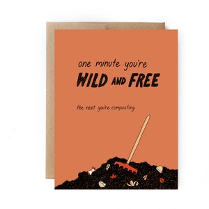 May include: A humorous greeting card with an orange background and black text that reads "one minute you're WILD AND FREE the next you're composting". The card features a cartoon illustration of a compost pile with a rake and various food scraps.