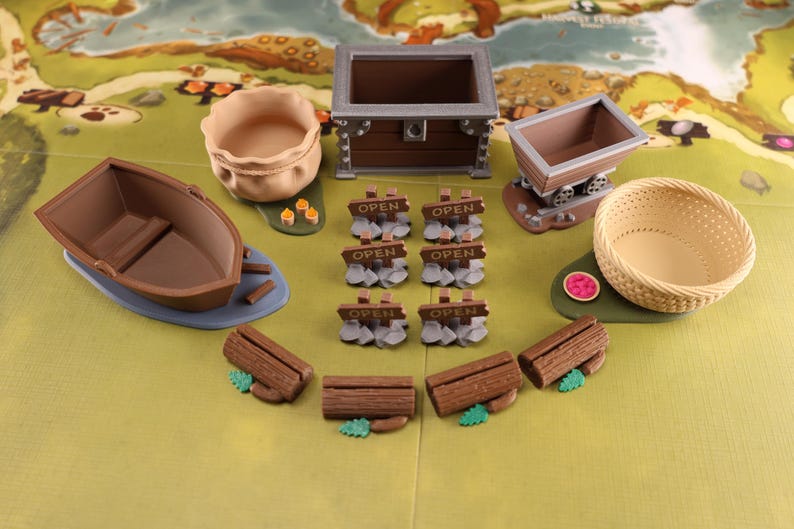 A full set of resource holders, open signs and card holders on an Everdell game board without resources in them.