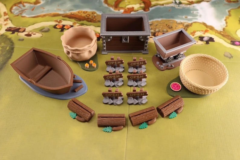 Empty Everdell resource holders on a game board: a pouch, boat, mine cart, berry basket and a coin chest. Also on the board there are 6 open signs and 4 log shaped event card holders.