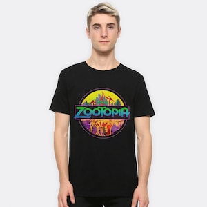 May include: Black t-shirt with a colorful graphic of the Zootopia logo. The logo features a cityscape with animals and the text "Zootopia" in a rainbow gradient.