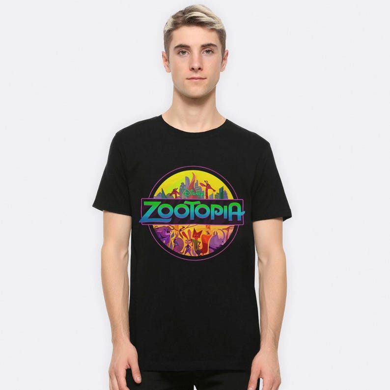 May include: Black t-shirt with a colorful graphic of the Zootopia logo. The logo features a cityscape with animals and the text "Zootopia" in a rainbow gradient.